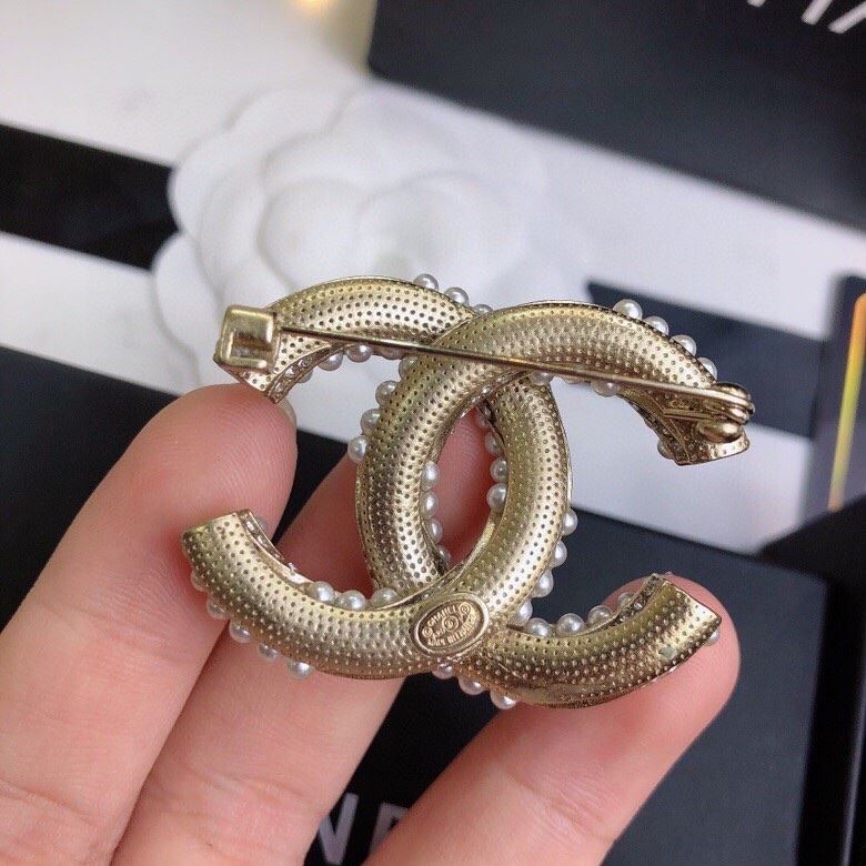 Ch**el brooches